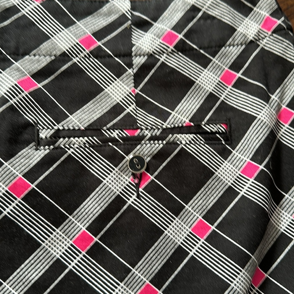 black mini skirt with pink triangles and white lines